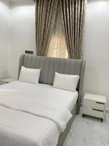 Postel nebo postele na pokoji v ubytování Dasah Apartment