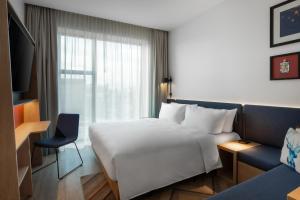Postel nebo postele na pokoji v ubytování Hampton By Hilton Tallinn