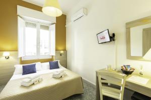 A bed or beds in a room at Kaliè Rooms Guest House