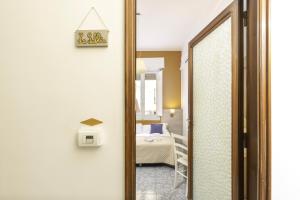 A bed or beds in a room at Kaliè Rooms Guest House