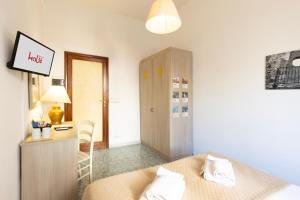 A bed or beds in a room at Kaliè Rooms Guest House