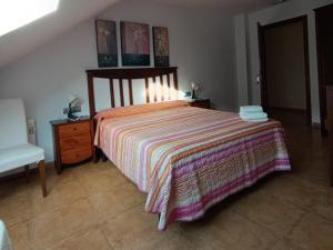 Łóżko lub łóżka w pokoju w obiekcie Pension Doña Lubina