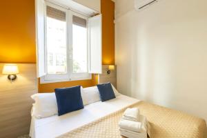 A bed or beds in a room at Kaliè Rooms Guest House