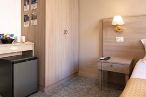 A kitchen or kitchenette at Kaliè Rooms Guest House