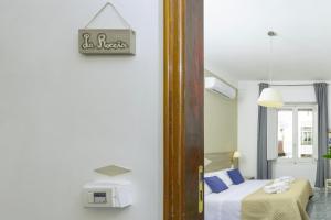 A bed or beds in a room at Kaliè Rooms Guest House