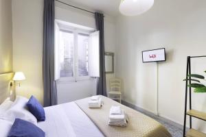 A bed or beds in a room at Kaliè Rooms Guest House