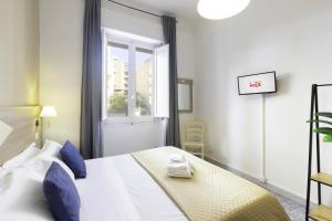 A bed or beds in a room at Kaliè Rooms Guest House