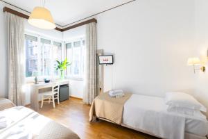 A bed or beds in a room at Kaliè Rooms Guest House
