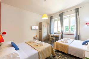 A bed or beds in a room at Kaliè Rooms Guest House