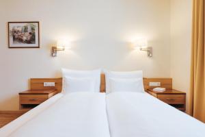 Hotel Schneider Dependance客房内的一张或多张床位