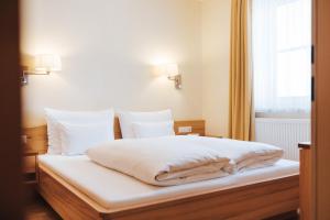 Hotel Schneider Dependance客房内的一张或多张床位