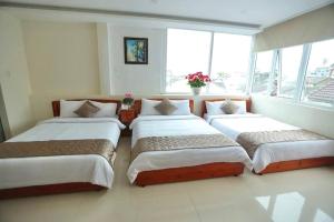 Postel nebo postele na pokoji v ubytování Hotel Phạm Duy
