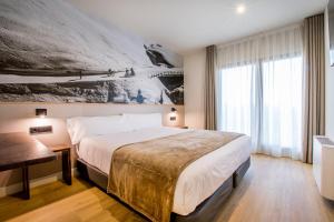 Voodi või voodid majutusasutuse Hotel Llivia toas
