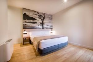 Voodi või voodid majutusasutuse Hotel Llivia toas