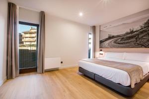 Voodi või voodid majutusasutuse Hotel Llivia toas