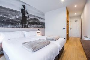 Voodi või voodid majutusasutuse Hotel Llivia toas