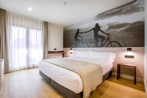 Voodi või voodid majutusasutuse Hotel Llivia toas
