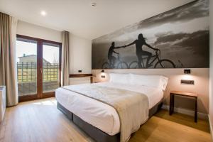 Voodi või voodid majutusasutuse Hotel Llivia toas