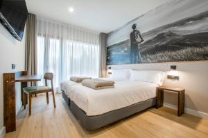 Voodi või voodid majutusasutuse Hotel Llivia toas