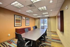 a conference room with a long table and chairs at Fairfield Inn & Suites by Marriott Milwaukee Airport in Oak Creek +13 photos
