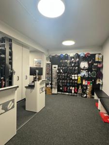 a room with a store with a lot of products at Alpeen Hotel in Les Menuires