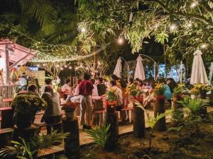 a crowd of people at a flower market at night at Hide Away Bungalows in Ben Tre City in Ben Tre
