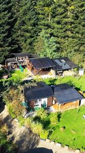 an aerial view of a house with solar panels on it at Zakątek u Poety Dąbrówka in Jasło