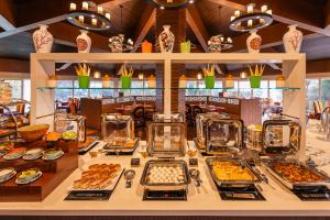 a buffet with many different types of food on a table at Sterling Darjeeling in Darjeeling