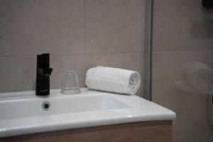 a bathroom sink with a roll of toilet paper on it at ho36 Les Menuires in Les Menuires +36 photos
