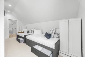 two bunk beds in a room with white walls at Talleyrand in Bar Harbor +47 photos