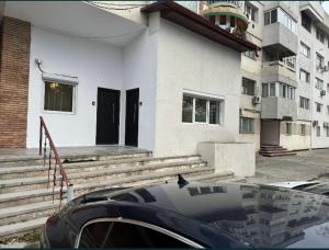 a house with a car parked in front of it at Glamorous One in Brăila