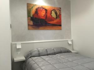 Postel nebo postele na pokoji v ubytování Picaflor Art & Rooms