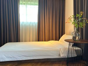 Letto o letti in una camera di 南浔浔溪之畔民宿