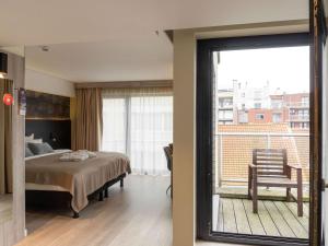 Кровать или кровати в номере Mercure Oostende