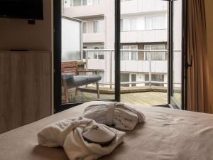Кровать или кровати в номере Mercure Oostende