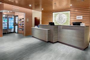 a lobby of a store with a counter and a cash register at Fairfield Inn & Suites by Marriott Queensbury Glens Falls/Lake George in Queensbury +12 photos