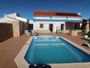 a swimming pool on the roof of a house at Ferienhaus Casa Limoeiro by fewo-plan ESTO101 an der Algarve in Azinheiro