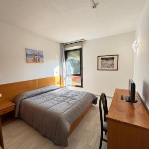 Postel nebo postele na pokoji v ubytování La Fenice Hotel