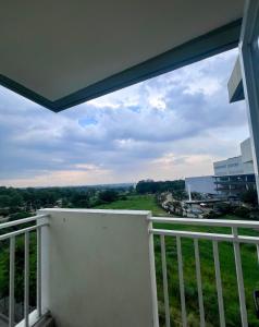 a balcony with a view of a city at 2 Bedroom Condo Unit with Balcony Amaia Steps Altaraza in Tunkong Manga