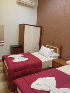 Voodi või voodid majutusasutuse Meramees Hotel toas