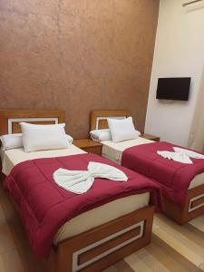 Voodi või voodid majutusasutuse Meramees Hotel toas