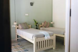 Postel nebo postele na pokoji v ubytování Mellow Hostel Sri Lanka