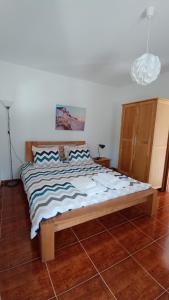 a large bed in a room with at Casa Machuca - espaço exclusivo com piscina in Tomar +23 photos
