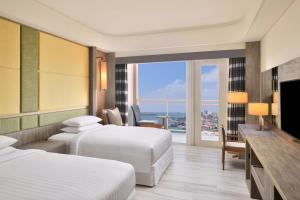 Ліжко або ліжка в номері Four Points By Sheraton Penghu