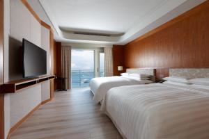 Ліжко або ліжка в номері Four Points By Sheraton Penghu
