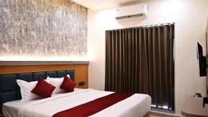 The Sky Comfort Hotel Mahi客房内的一张或多张床位