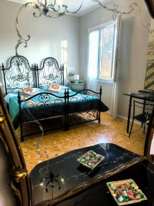 a bedroom with a bed and a table with a tray at la Brunita in Rubiera