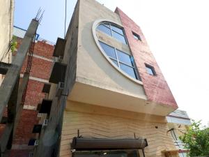 a building with a round window on the side of it at Hotel O Mall Residency in Amritsar