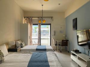 Tempat tidur dalam kamar di 心適都蘭Comfy Inn, Dulan