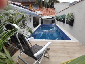 A piscina localizada em Pousada Hospedaria215 ou nos arredores